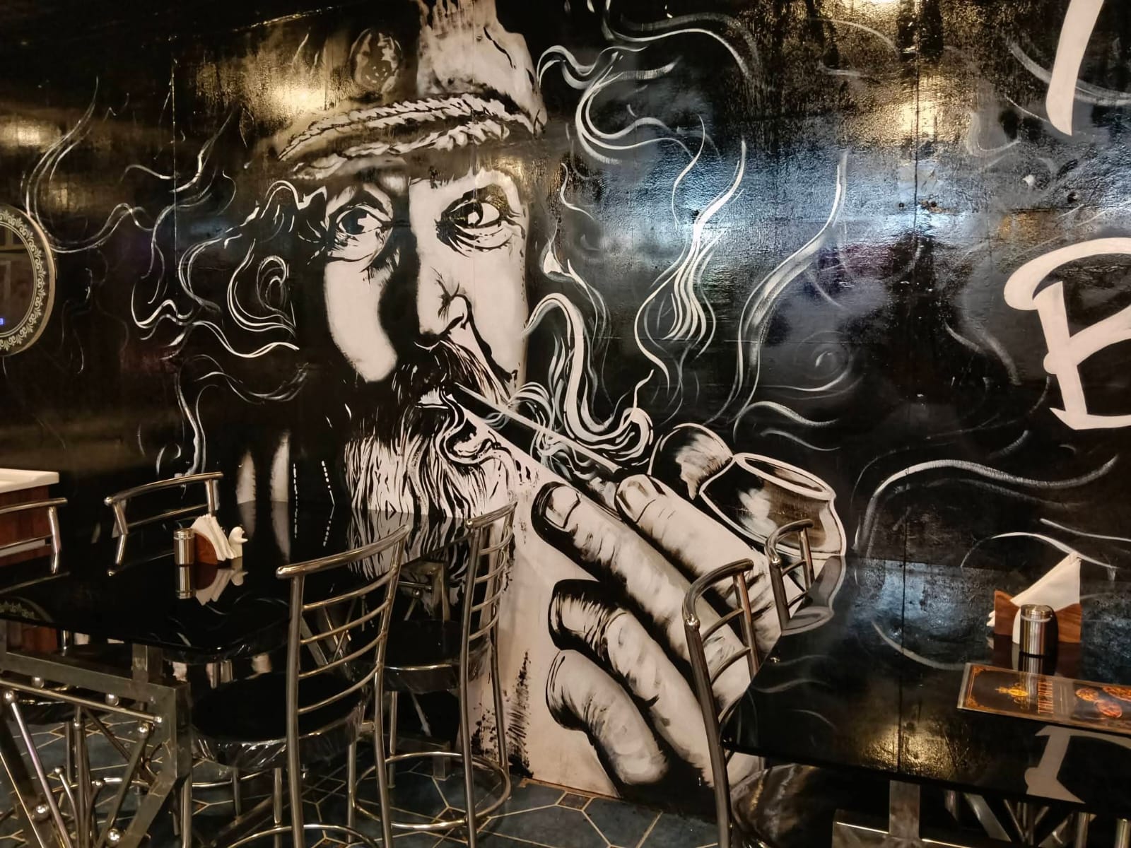 Street-art wall at the entrance.