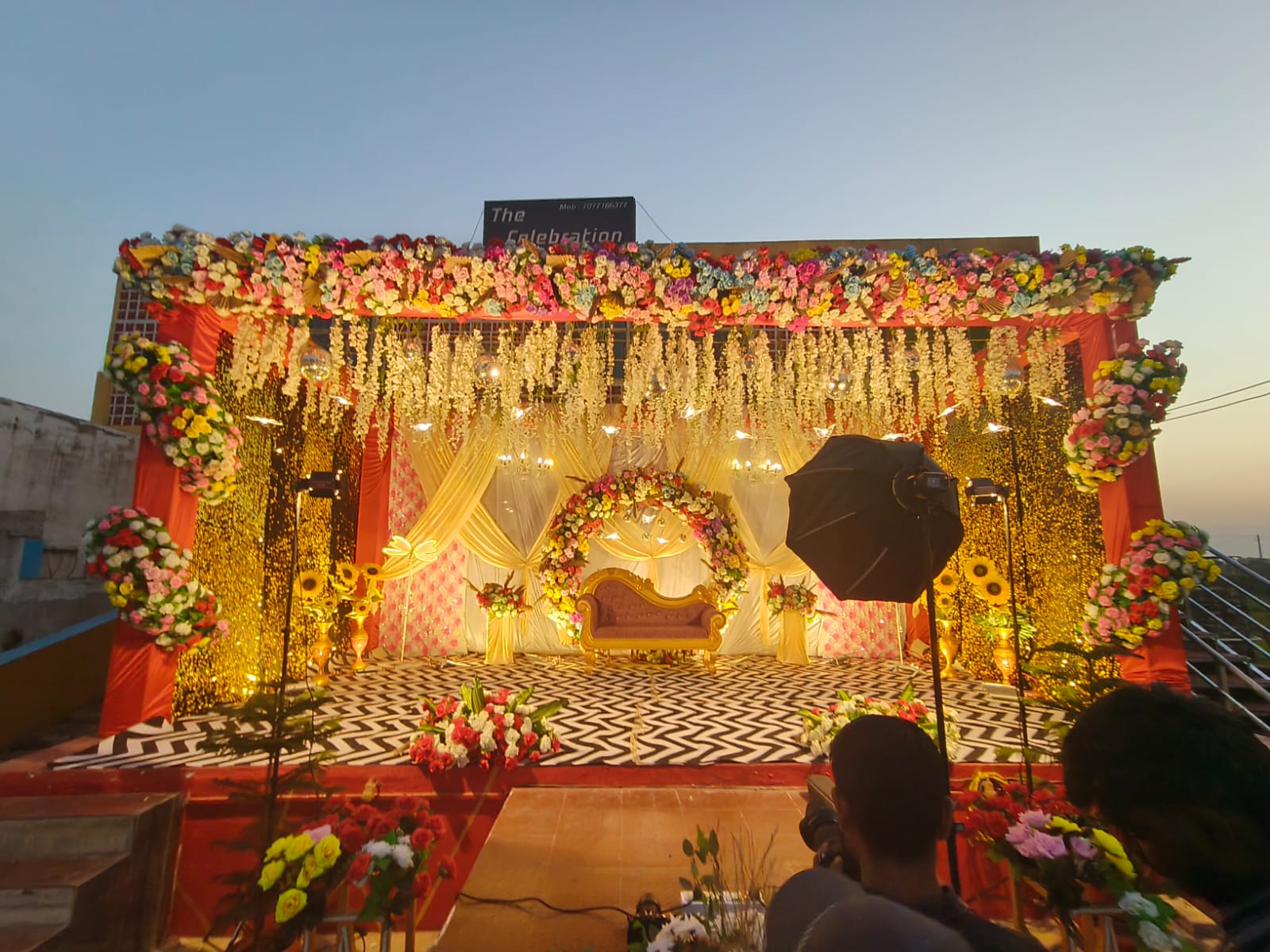 Royal seating & floral arch.
